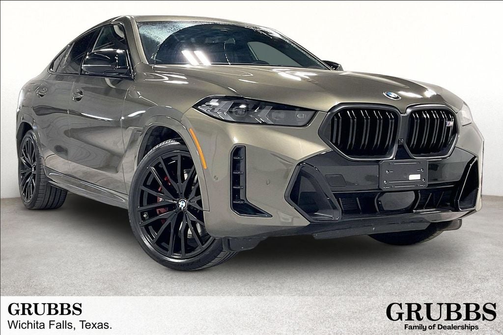 2025 BMW X6 M60i in Manhattan Green Metallic — front three-quarter view