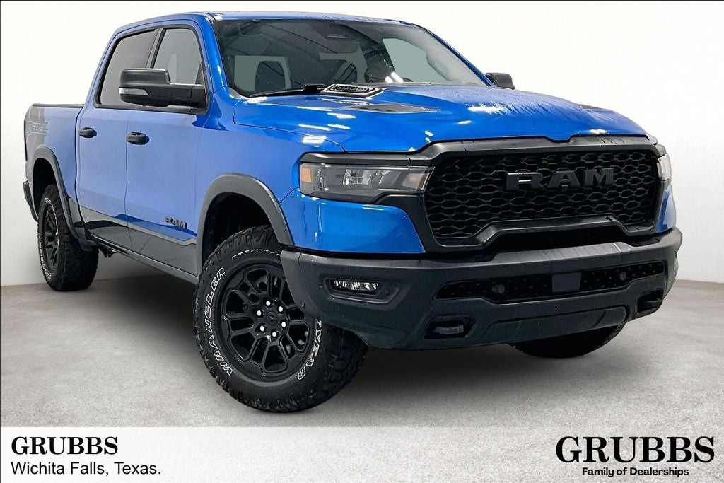 2025 RAM 1500 Rebel in Hydro Blue Pearlcoat — front three-quarter view